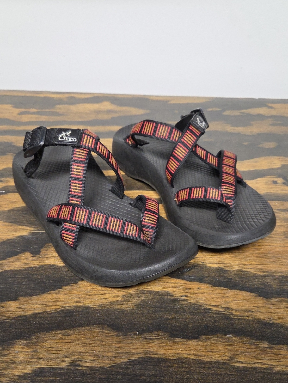 Chaco Black Sandals with Red and Orange Striped Webbing